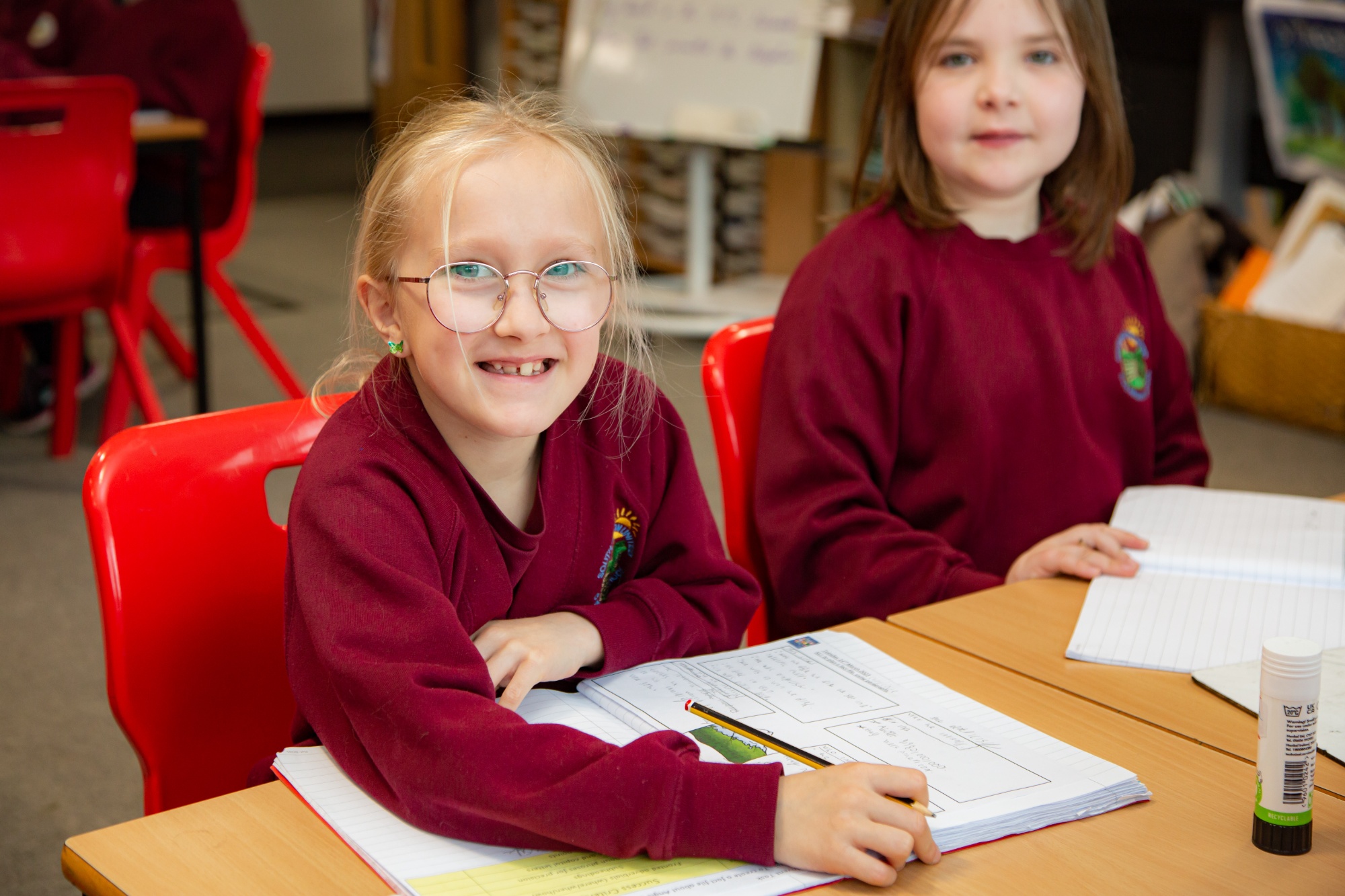 girl sat at desk