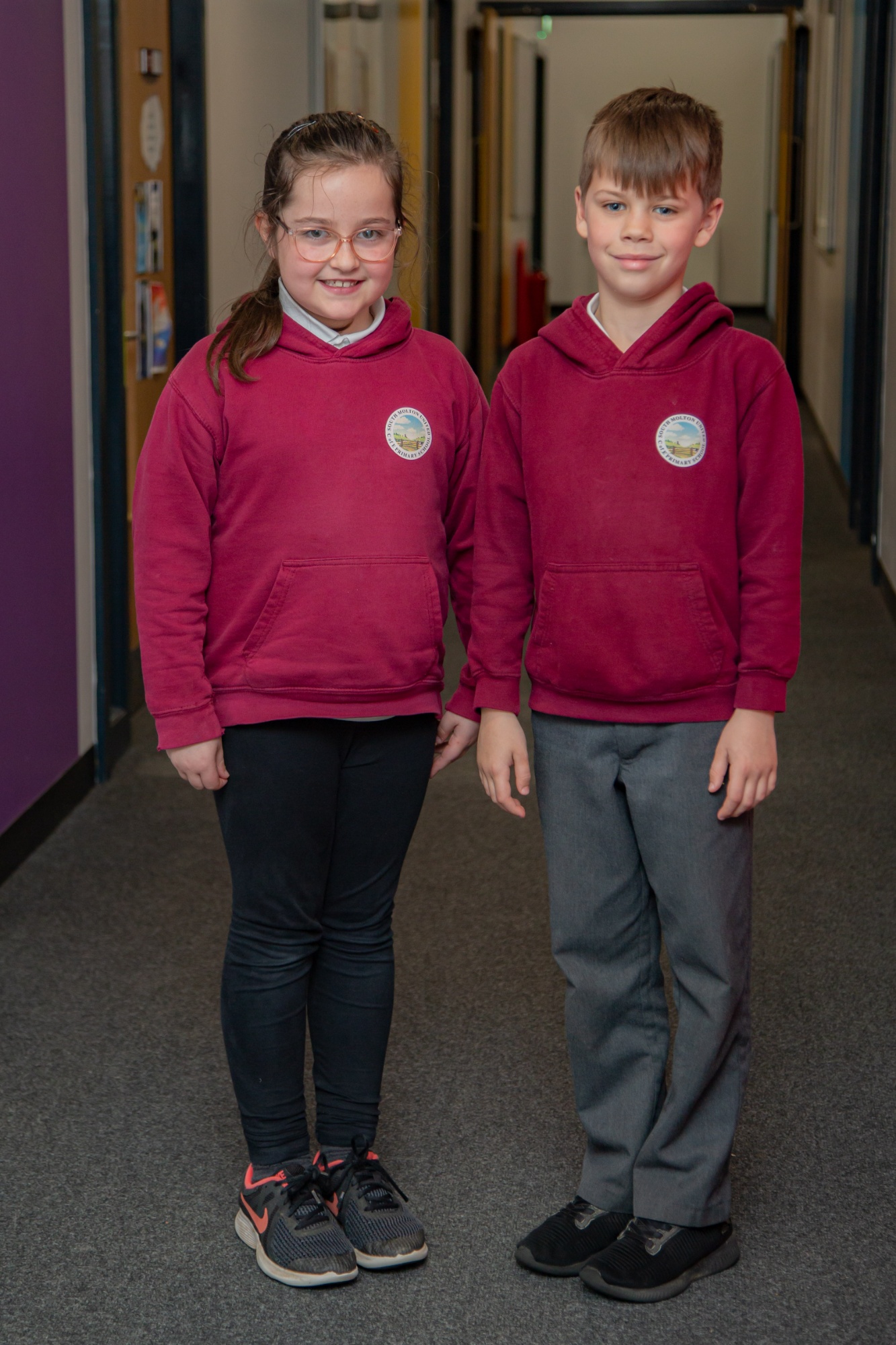boy and girl in school uniform